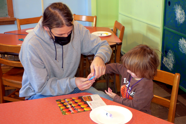 Kyle learning how to use scissors with his Dad.