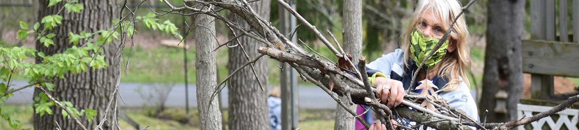 woman volunteering to clean up park