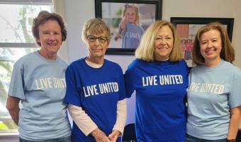 Group of friends volunteering at United Way office in Annville.